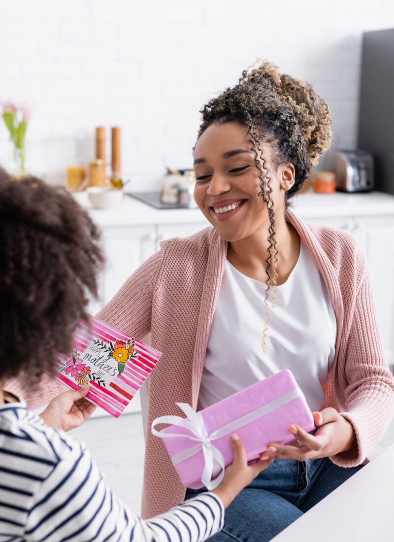 Mom receiving gift from daughter